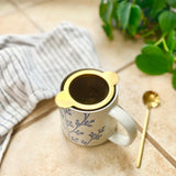 gold tea strainer top view